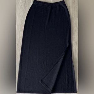 Pre loved, size 12, St. John Evening black knit long skirt with side slit.